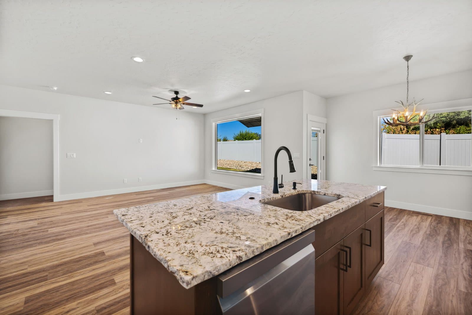 Open kitchen island looking into the living room of an Old's Ferry home