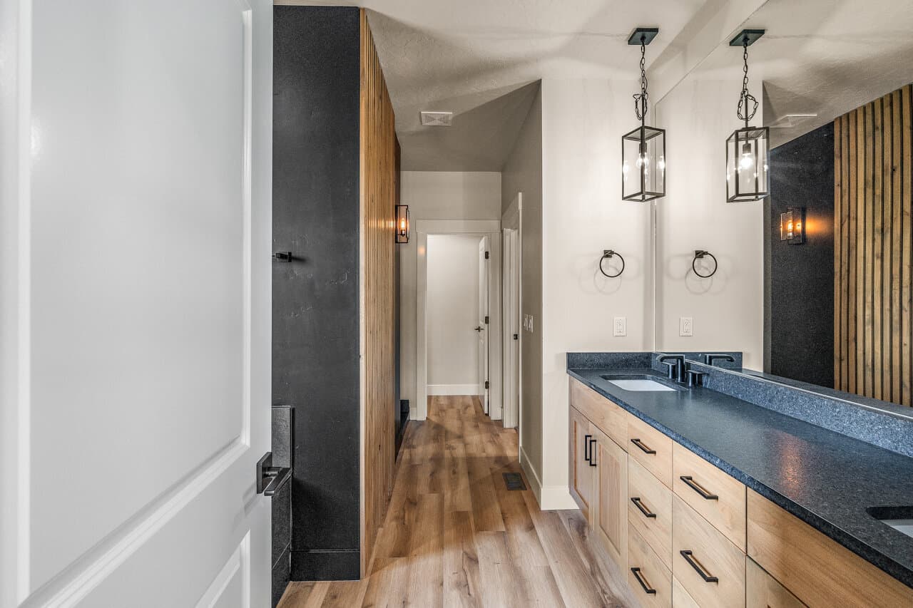 Vanity and hallway with wood slat detail at 16966 Long Meadow Dr