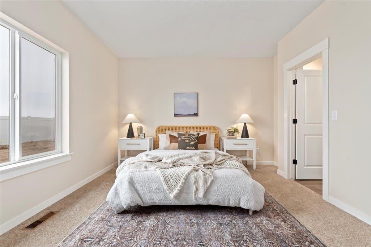 Primary bedroom in an Old's Ferry home