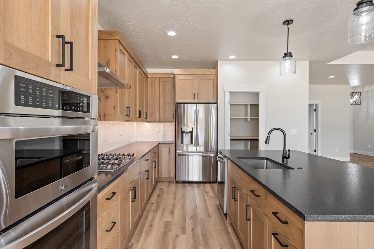 Kitchen with wood cabinetry at 16966 Long Meadow Dr